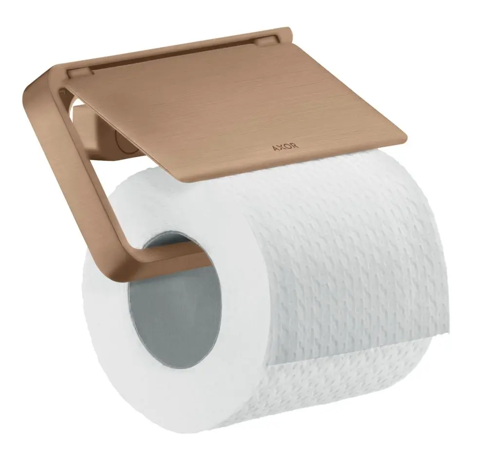 Toilettenpapierhalter mit Deckel in brushed red gold, montiert an einer Wand. Produkthersteller ist AXOR. Halter wird mit einer Rolle Toilettenpapier verwendet.